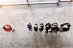 Overhead view of business team in a row in front of boss