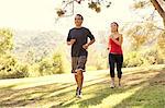 Mature couple running in park
