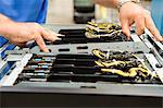 Cropped image of male technician examining computer card slots in electronics industry