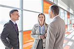 Businesspeople communicating on train platform