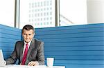 Mature businessman using laptop at desk