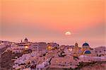 The village of Oia in the evening at sunset, Santorini (Thira) Cyclades Islands, Greek Islands, Greece, Europe