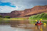 Couple kayaking down the Colorado River, Castle Valley near Moab, Utah, United States of America, North America