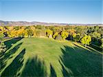 aerial view of park in fall colors under morning light with deep long shadows, Fort Collins, Colorado,