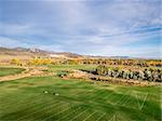 aerial view of a park, recreation soccer fields and bike trails at Rocky Mountains foothill, Fort Collins, Colorado