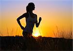 Young Beautiful Woman Running on the Mountain Trail in the Morning. Active Lifestyle