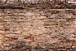 old brick wall with loose bricks. Textured background