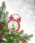 Christmas background with clock, snow fir tree and copy space with bokeh