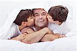 Happy and proud father with his loving sons - family enjoying time together