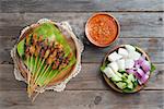 Hot and spicy Asian dish. Chicken sate or satay, skewered and grilled meat, served with peanut sauce. Fresh cooked with steamed and smoke.