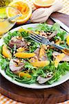 Salad with roasted duck breast and orange