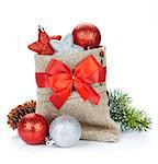 Christmas bag with baubles and fir tree. Isolated on white background