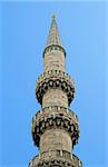 Minaret against clear blue sky, view from below