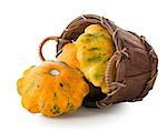 Gourds in a basket isolated on a white background