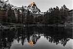 The top of the Matterhorn lit by the sun at sunset, Aosta Valley