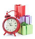 Christmas clock and three gift boxes. Isolated on white background