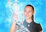 Beautiful young girl looks at model of DNA and presses her finger. Scientific and medical concept