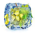 Green grape in ice cube isolated on white