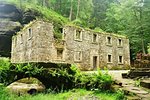 Old Dolsky mill with Kamenice river and fog