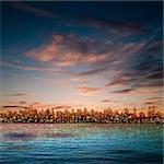 abstract nature blue background with panorama of city and brown clouds