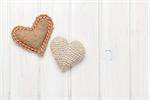 Valentines day toy hearts over wooden table background with copy space