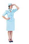 Pretty air hostess with hand on hip on white background