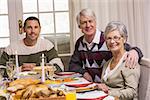 Happy family during christmas dinner at home in the living room