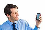 Smiling businessman showing smartphone to camera on white background