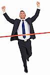 Businessman crossing finish line and cheering on white background