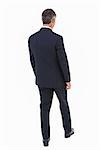 Rear view of a businessman posing on white background