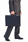 Businessman holding briefcase walking on white background