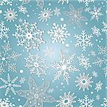 gentle winter pattern of different snowflakes on a blue background