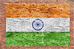 Flag of India painted over old brick wall