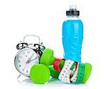 Two green dumbells, tape measure, drink bottle and alarm clock. Fitness and health. Isolated on white background