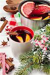 Christmas mulled wine on wooden table closeup