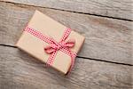 Gift box on wooden table background with copy space