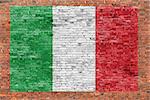 Flag of Italy painted over aged brick wall