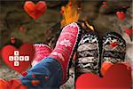 Close up of romantic legs in socks in front of fireplace against love you tiles