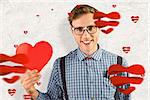 Geeky hipster holding a heart card against parchment