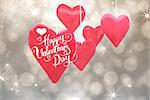 Happy valentines day against shimmering light design on grey