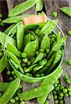 Fresh green peas in a bucket