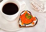 Romantic breakfast with heart shaped toasts  with red caviar and coffee - Valentine concept