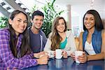 Young students having coffee together at the university