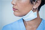 Close up mid section of female dentist wearing surgical mask