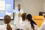 Science professor giving lecture to class at the university