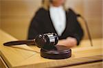 Gavel resting on sounding block in the court room