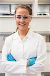 Young pharmacist smiling at camera at the laboratory