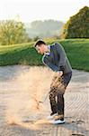 Man in Sand Trap Playing Golf on Golf Course in Autumn, Bavaria, Germany