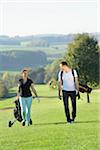 Couple Playing Golf on Golf Course in Autumn, Bavaria, Germany