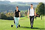 Couple Playing Golf on Golf Course in Autumn, Bavaria, Germany